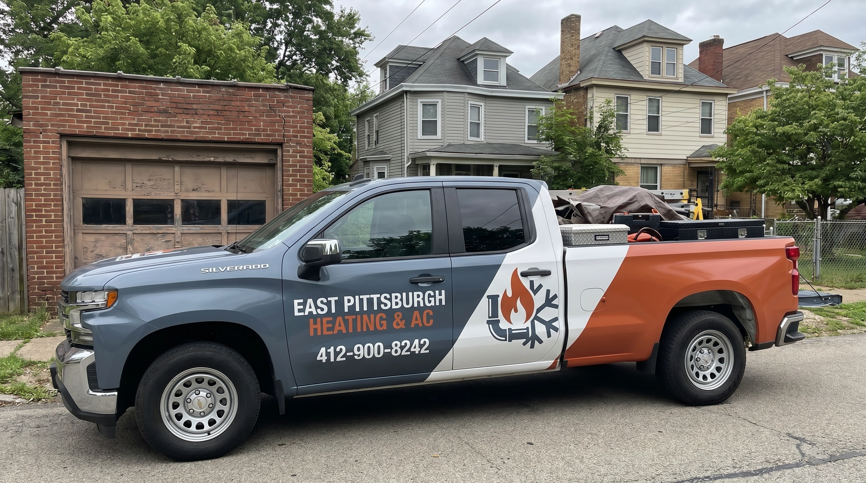 HVAC technician servicing a heating system in Pittsburgh, PA